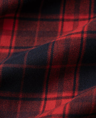 Close-up of red and dark navy plaid heavyweight work shirt fabric weave and pattern
