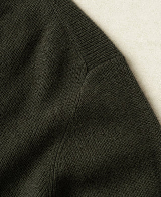 Olive knit cardigan side seam and knit texture close-up