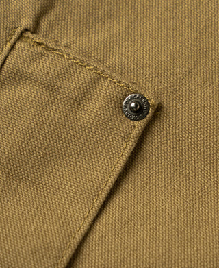 Khaki canvas field jacket button and stitched seam detail