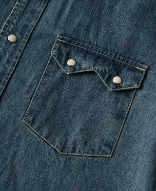 Denim shirt chest pockets with pointed flaps and metal snap buttons