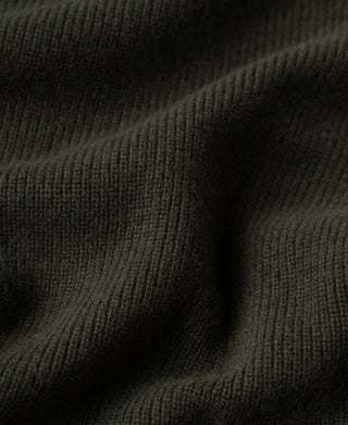 Olive knit cardigan fabric close-up with smooth ribbed texture