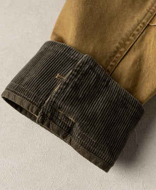 Khaki jacket sleeve with dark corduroy cuff lining