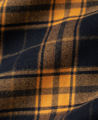 Yellow and dark plaid heavyweight work shirt fabric close-up
