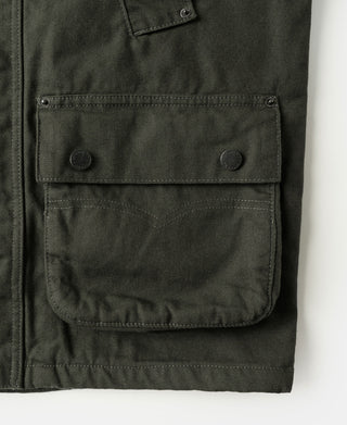 Olive canvas field jacket front with flap chest pocket and snap buttons