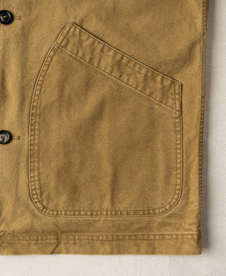 Khaki canvas field jacket with large front patch pocket and black buttons