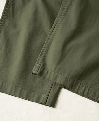 Olive cargo trouser lower leg with stitched hem and straight fall