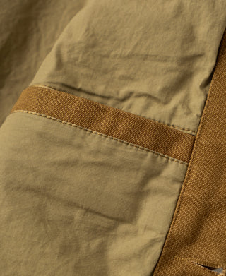 Khaki cotton canvas hunting jacket interior pocket opening with stitched trim