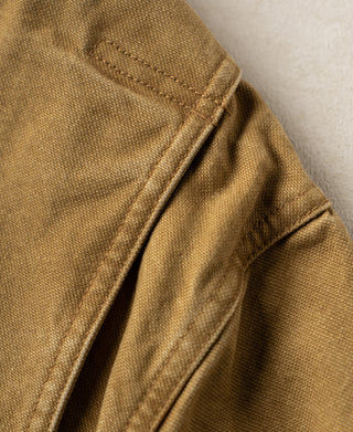 Khaki canvas field jacket sleeve with reinforced stitching
