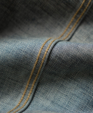 Indigo denim collar seam and topstitching close-up