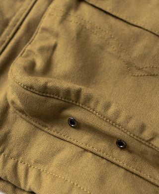 Khaki canvas jacket pocket flap with two metal buttons