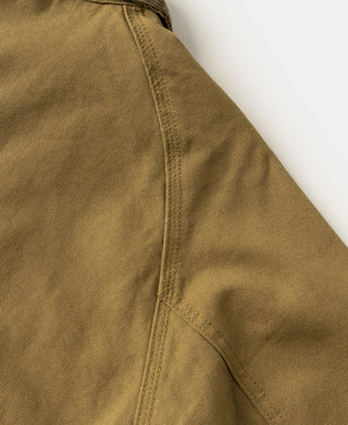 Khaki canvas jacket side seam with panel stitching
