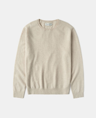 Apricot merino wool crewneck sweater with ribbed cuffs and hem.