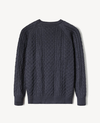 Dark blue cable knit fisherman sweater with crew neck and textured aran cables