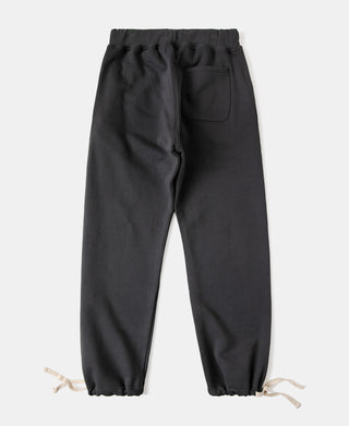 Black heavyweight terry sweatpants with elastic waistband and drawstring, side pocket