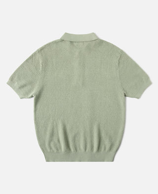Light green jacquard short-sleeve polo shirt, back view with ribbed hem