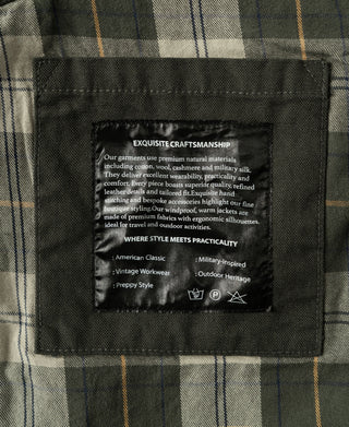 Olive canvas field jacket interior brand label on plaid lining