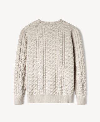 Cream crewneck cable knit sweater with long sleeves and ribbed cuffs and hem