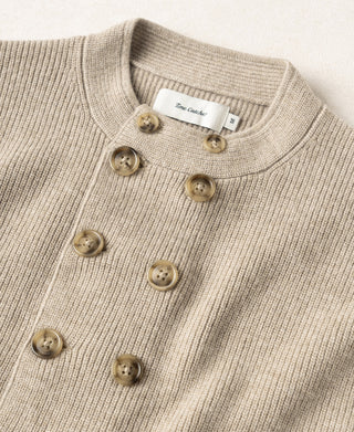 Ecru double-breasted knit cardigan with four button placket and ribbed crew neckline
