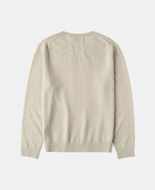 Apricot merino wool crewneck sweater back view with ribbed hem and cuffs.