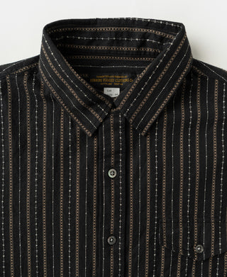 Close-up of shirt collar, vertical jacquard stripes, buttons, and chest pocket