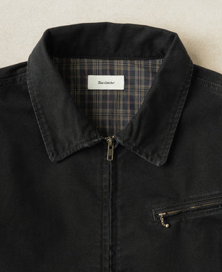 Black jacket collar with plaid-lined interior and center front zipper