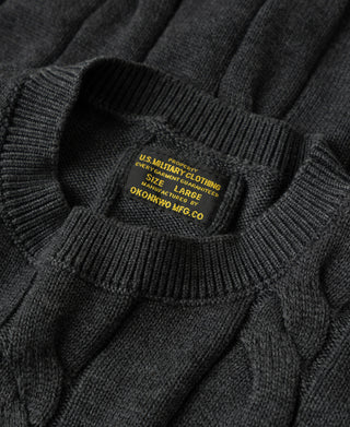 Crewneck ribbed collar with interior size tag on dark gray sweater