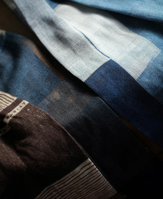 Close-up of blue, white, and brown patchwork prints on the neck scarves