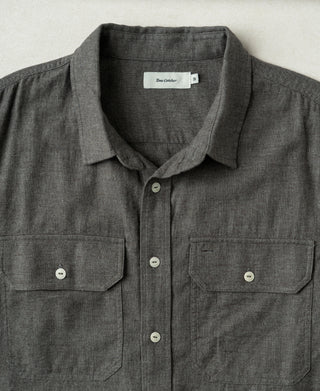 Dark gray brushed cotton flannel work shirt close-up, spread collar and chest pockets