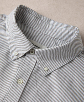 Striped button-down shirt collar and interior neck opening, close-up