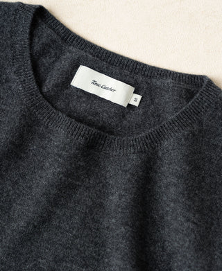 Heather gray merino wool crewneck sweater with ribbed collar and interior brand tag