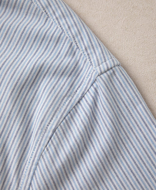 Side seam and curved cuff area on blue stripe button-down shirt