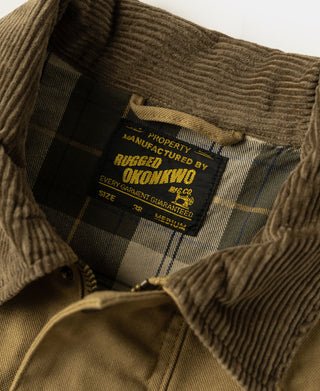 Khaki field jacket lining close-up with plaid fabric and stitched size label