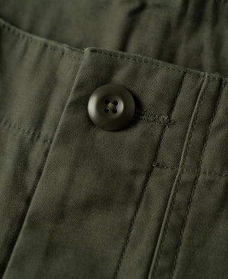 Olive cargo pocket flap with round button and stitched seam