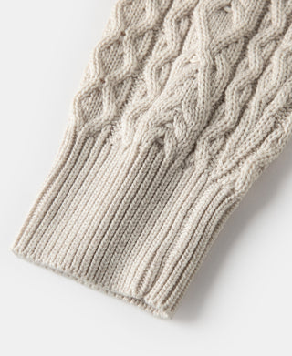 Cream knit fisherman sweater with ribbed hem and cable stitch texture detail