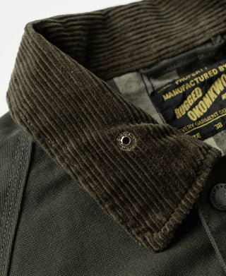 Corduroy-lined olive collar on an olive canvas field jacket with manufacturer label