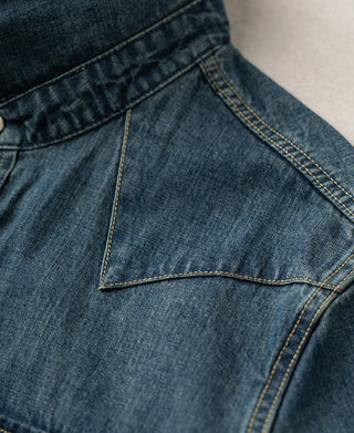 Denim yoke with curved contrast topstitching under the collar