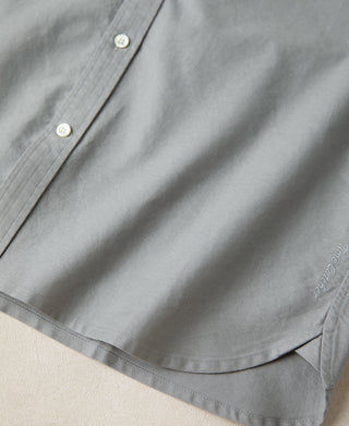 Gray shirt hem with curved vent and stitched interior facing