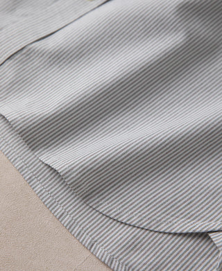 Striped shirt placket and curved hem edge, close-up