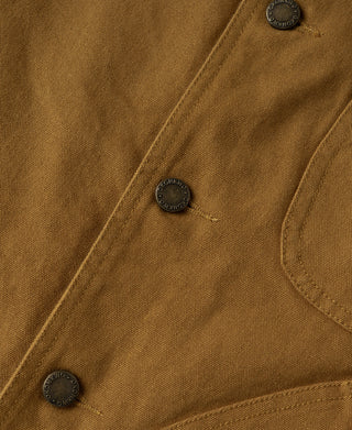 Khaki hunting jacket close-up of snap placket and round buttons