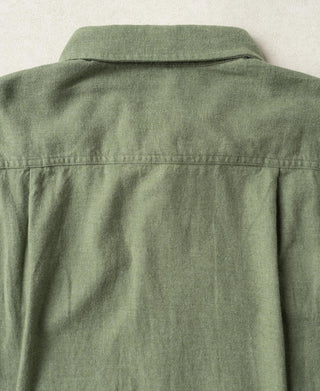Back view of sage flannel work shirt with yoke seam detail