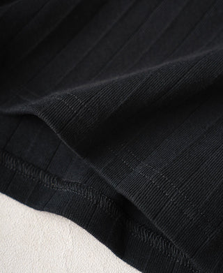 Black ribbed cotton T-shirt hem with stitched edge and textured knit