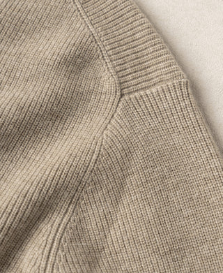 Ecru knit cardigan sleeve with ribbed cuff and button-placket seam