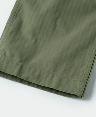 Olive fatigue trousers hem with clean edge stitching