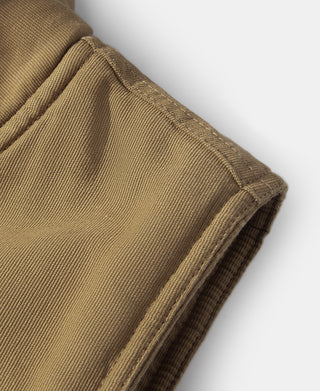 Deck vest shoulder seam and bound armhole in khaki fabric