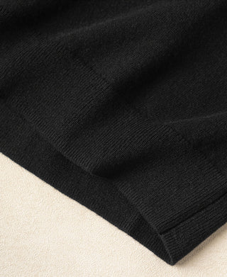 Black merino wool sweater cuff and ribbed bottom hem detail