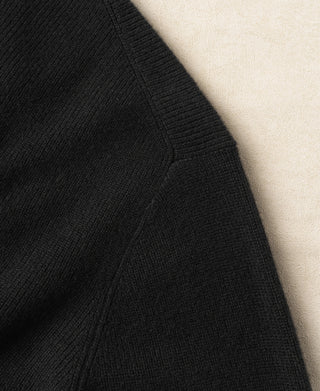 Black knit cardigan side seam with ribbed trim detail