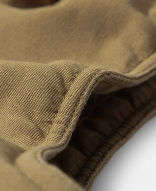 Deck vest close-up showing the bound edge and dark shearling lining