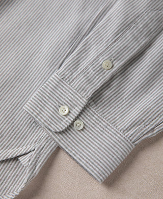Striped cuff with two buttons and stitched detail, close-up
