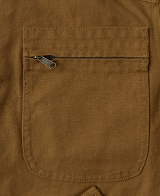 Khaki jacket chest pocket with metal zipper pull and stitched pocket opening