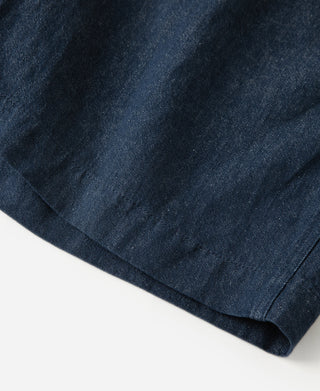 leg opening detail of Indigo Relaxed Double-Pleated Hemp-Cotton Shorts